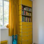 Craig Ford's vinyl and book storage in his modernist home.