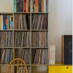 Craig Ford's vinyl and book storage in his modernist home.