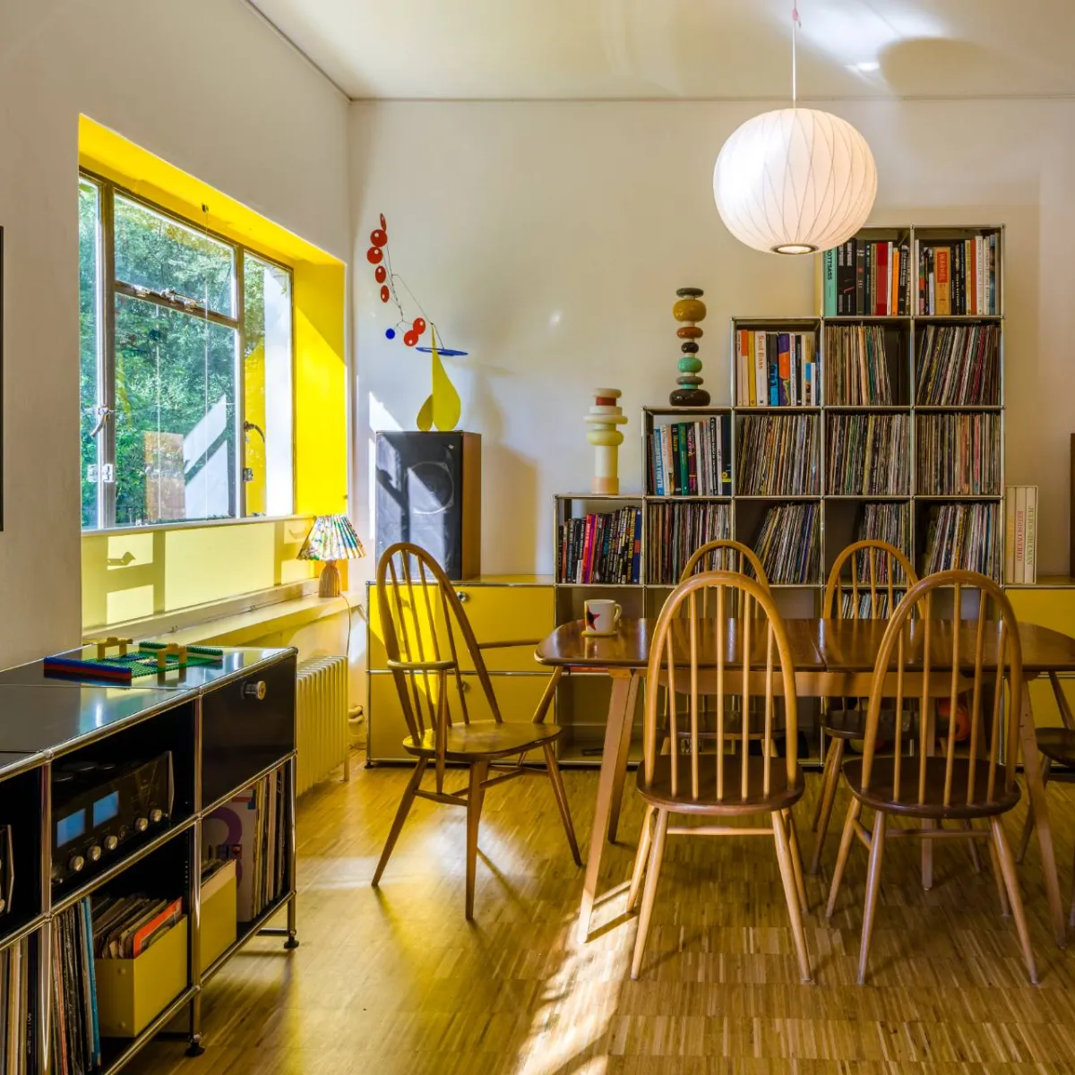 Craig Ford's vinyl and book storage in his modernist home.