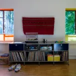 Craig Ford's vinyl and book storage in his modernist home.