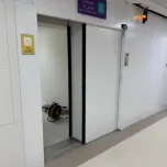 Sliding radiation shielding doors