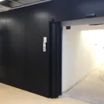 Sliding radiation shielding doors