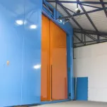 Sliding radiation shielding doors