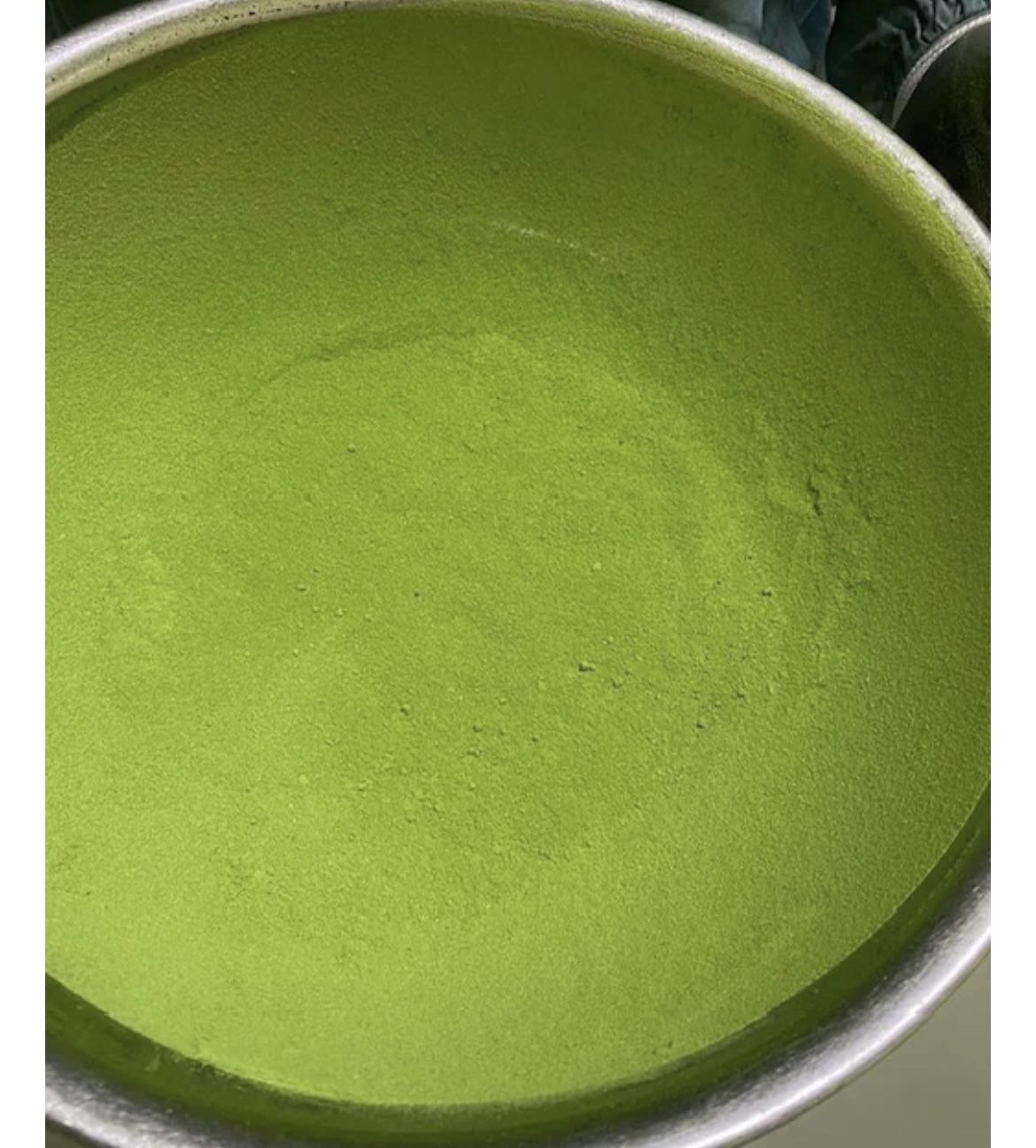 Green powder mixed with butterfly pea and turmeric powder