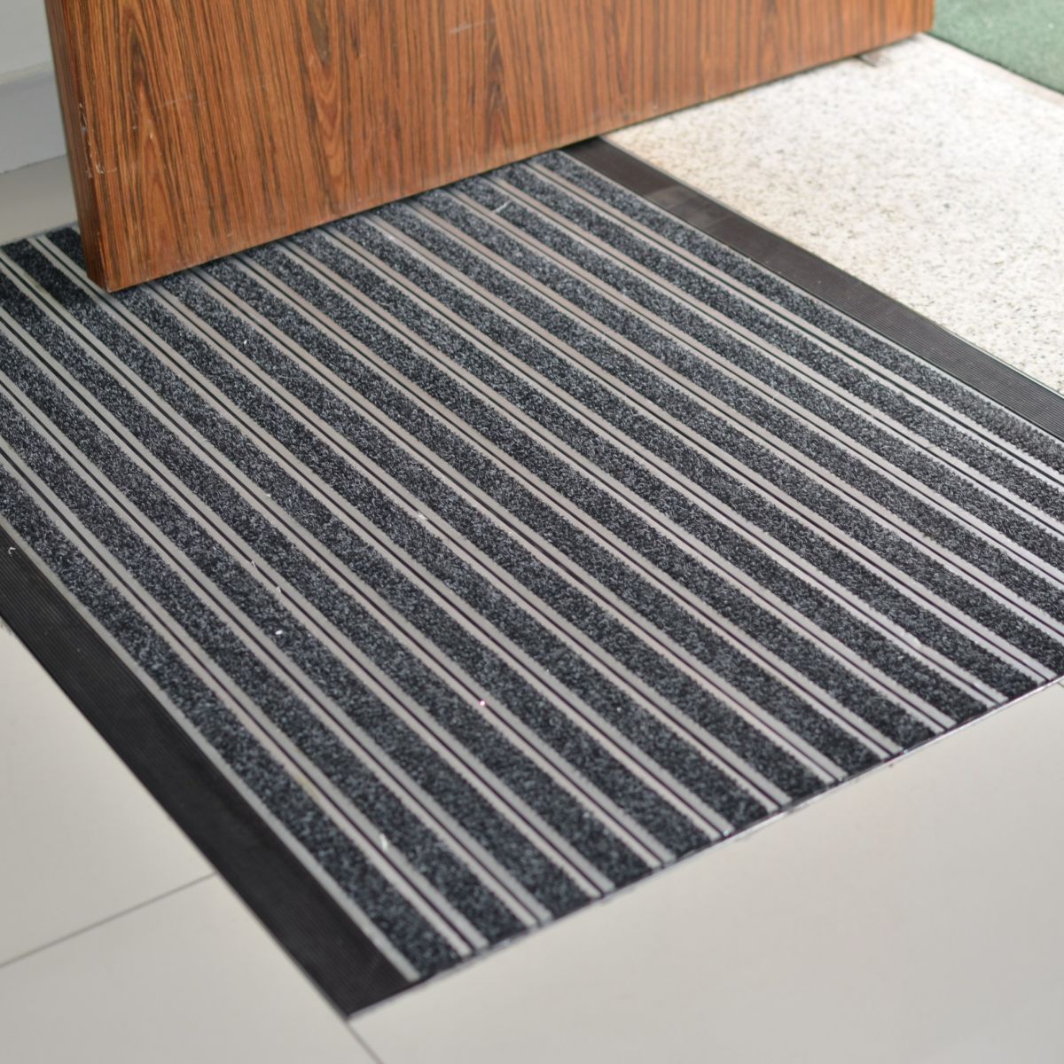 Tapete retentor de sujidade