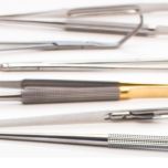 Hand-held, reusable, premium grade surgical instruments